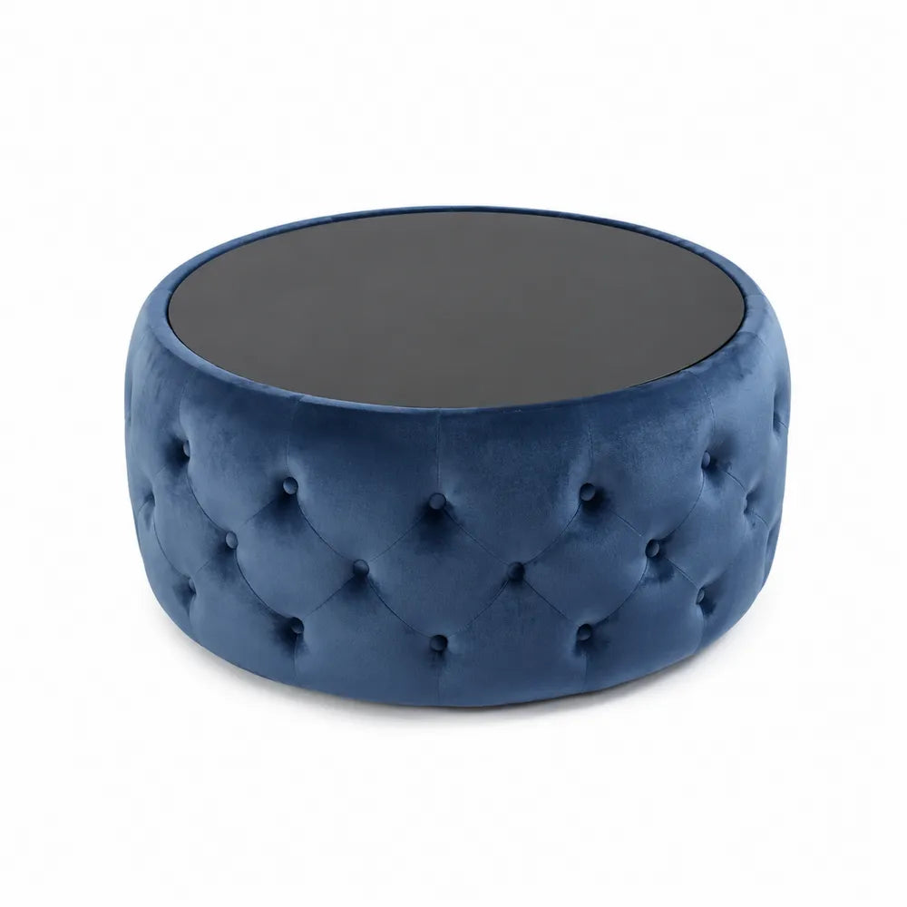 Pouf rotondo in velluto blu con superficie in vetro